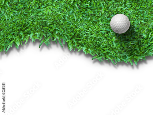 Photo: White golf ball on green grass isolated White golf ball on green grass isolated
