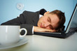 Tired man sleeping on a notebook