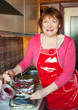 Woman making mackerel with cranberry