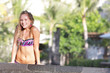young smiling woman on tropical beach background young smiling woman on tropical beach background