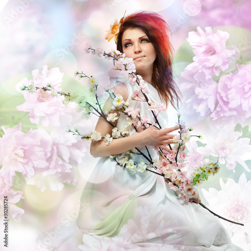 Photo: Portrait of beautiful woman with spring flowers Portrait of beautiful woman with spring flowers