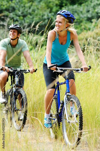 Photo: mountainbike couple outdoors mountainbike couple outdoors
