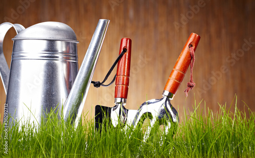 Photo: Garden tools on wooden wall Garden tools on wooden wall