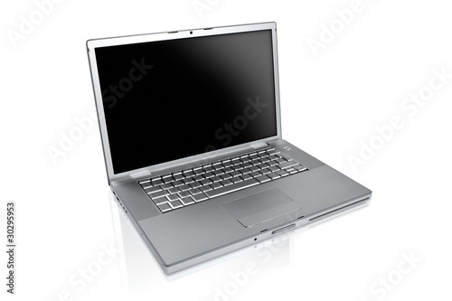 Photo : a silver laptop on a white background a silver laptop on a white background