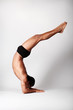 young male dancer posing over grey background young male dancer posing over grey background