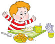 cheerful boy with fat cheeks at the dinner table