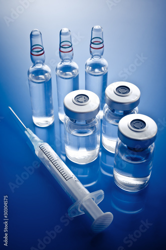 Photo: Medicine vials and syringe Medicine vials and syringe