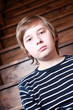 Teenager at the wooden stairs.