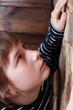 Young boy looking up.