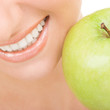 healthy teeth and green apple