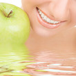 healthy teeth and green apple