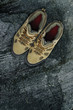 Walking boots on rock background