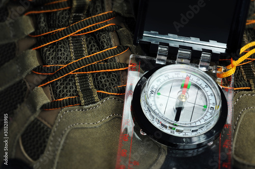 Photo: Compass and walking boots Compass and walking boots