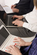 Office managers working with laptops