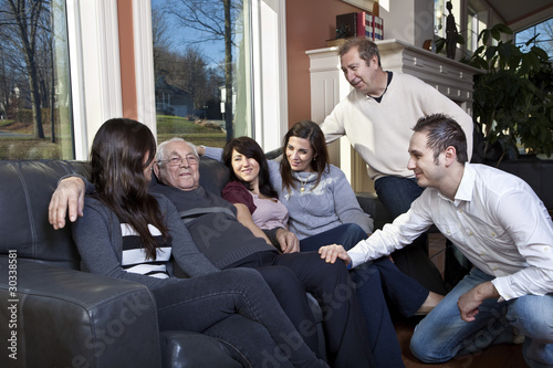 Photo: Family visiting elderly relative at a retirement home Family visiting elderly relative at a retirement home
