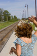 Commuter train woman waving