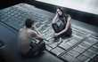 Conceptual photo of a couple sitting on laptop Conceptual photo of a couple sitting on laptop