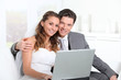 Photo: Bride and groom surfing on internet Bride and groom surfing on internet