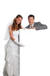 Photo: Bride and groom holding whiteboard Bride and groom holding whiteboard