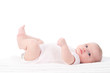 Baby liegt auf den Rücken und Strampelt