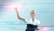 Attractive blonde touching the world map in virtual future