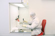 technician working in a clean room in laboratory technician working in a clean room in laboratory