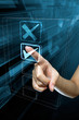 Photo : A woman hand selects an option on a screen A woman hand selects an option on a screen