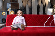Photo: baby on red sofa baby on red sofa