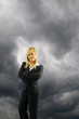 Businesswoman and black cloud