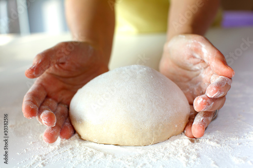 Photo: Bread making and kneading on the dusted workspace Bread making and kneading on the dusted workspace