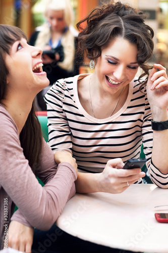 Photo: Two beautiful girls smiling Two beautiful girls smiling