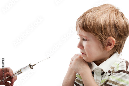 Photo: Syringe injecting child Syringe injecting child
