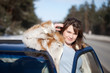 Happy woman with her car