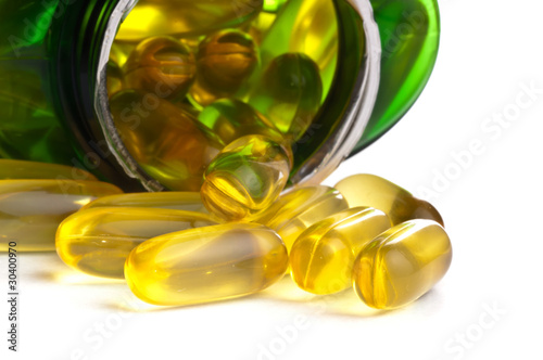 Photo: One bottle of omega 3 capsules over white background One bottle of omega 3 capsules over white background