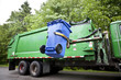 Recycling truck picking up bin