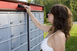 Young woman mailing a letter