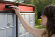 Young woman mailing a letter