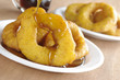 Pouring syrup on the Peruvian dessert called "picarones"