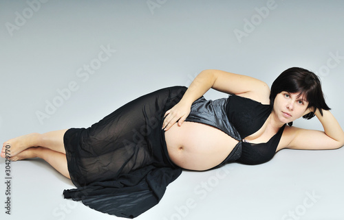 Photo: laying pregnant woman laying pregnant woman