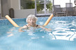 Photo: Senior woman aqua fitness Senior woman aqua fitness