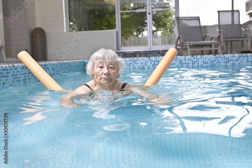 Photo: Senior woman aqua fitness Senior woman aqua fitness