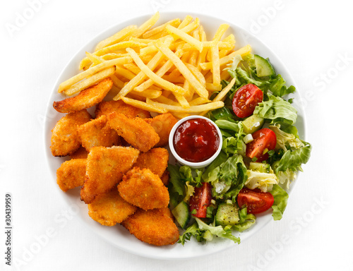 chicken nuggets and fries. Fried chicken nuggets, French