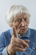 Scolding senior woman head and shoulders portrait