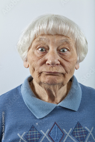 Photo: Goofy senior woman head and shoulders portrait Goofy senior woman head and shoulders portrait