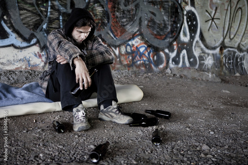 Photo: Homeless alcoholic drinking beer Homeless alcoholic drinking beer