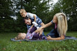 Young family playing at a park Young family playing at a park