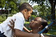 Mother and son playing at a park Mother and son playing at a park