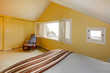 Cozy simple guest bedroom with vaulted ceiling