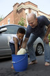 Father and son washing a car Father and son washing a car