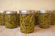 Home canned green beans cooling on the counter